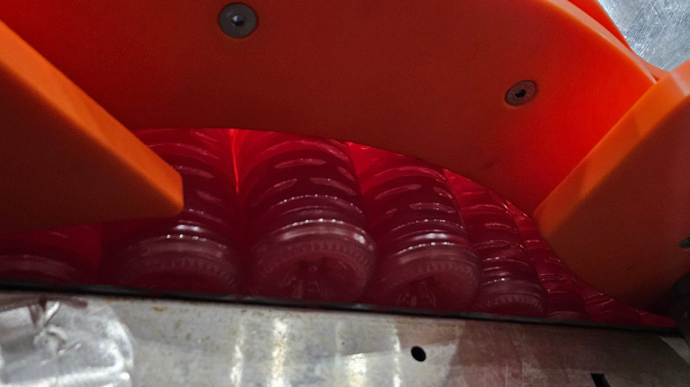 Under view of downed bottle reject opening
